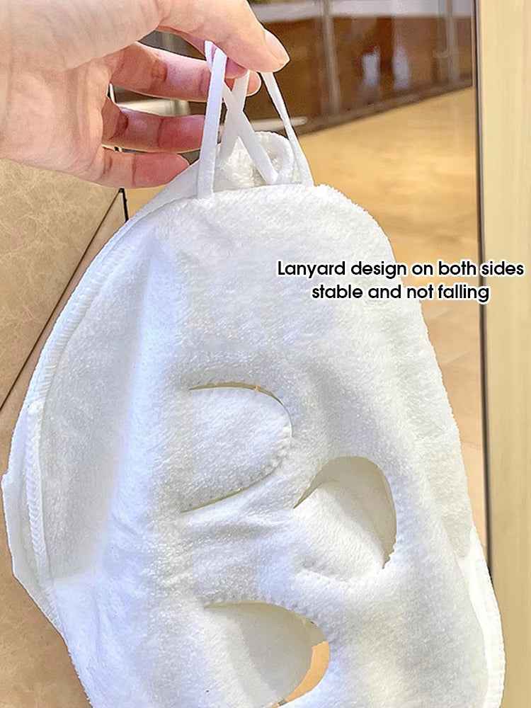 Warm compress cloth held against the face